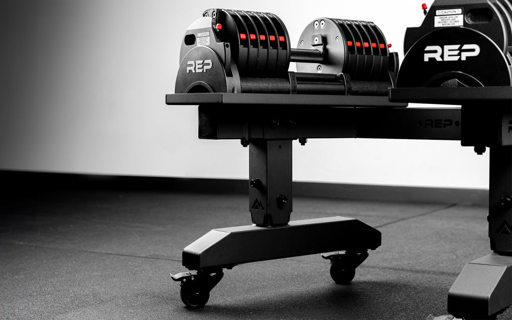 Close-up of the REP QuickDraw adjustable dumbbells on the REP Fitness adjustable storage stand