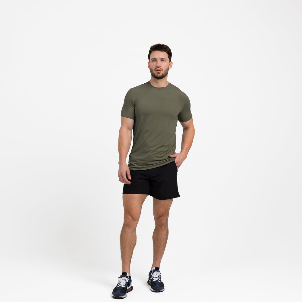 Athlete wearing a olive REP Men's Delta Tee.