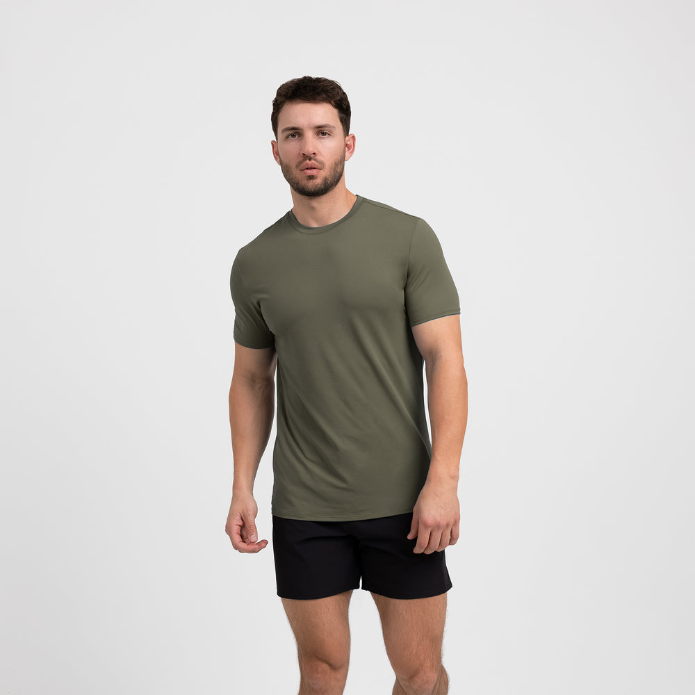 Athlete wearing a olive REP Men's Delta Tee.