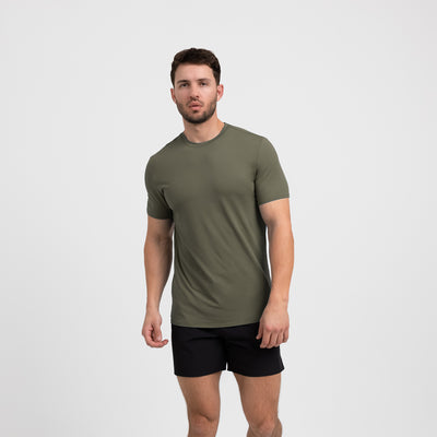 Athlete wearing a olive REP Men's Delta Tee.