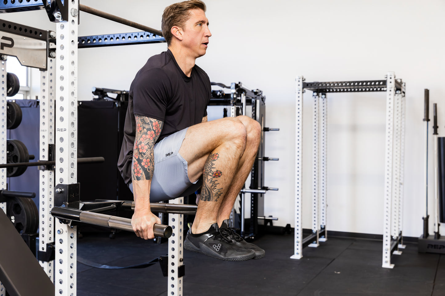 Athlete doing knee raises on the REP Fitness Dip Attachment 2.0