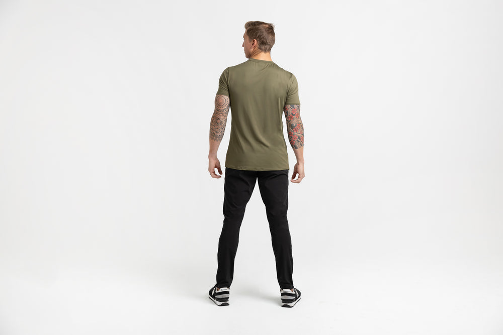 Rear shot of an athlete posing in black Men's Felix Pants 2.0