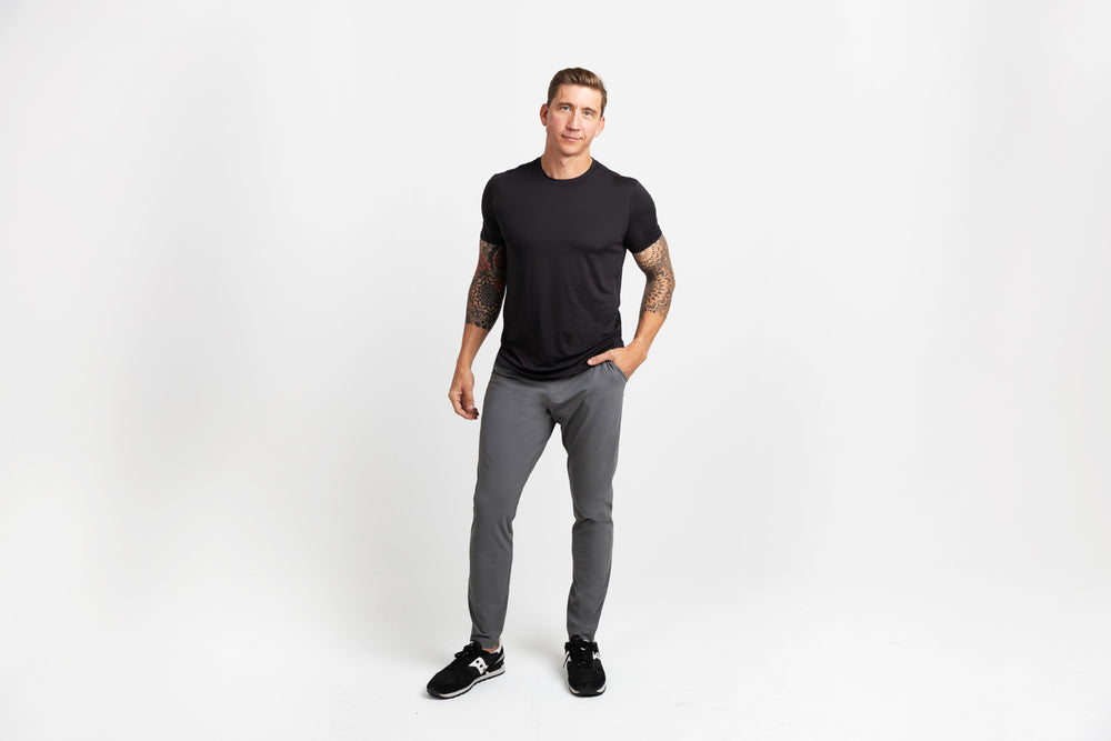 Front shot of an athlete in grey Men's Felix Pants 2.0