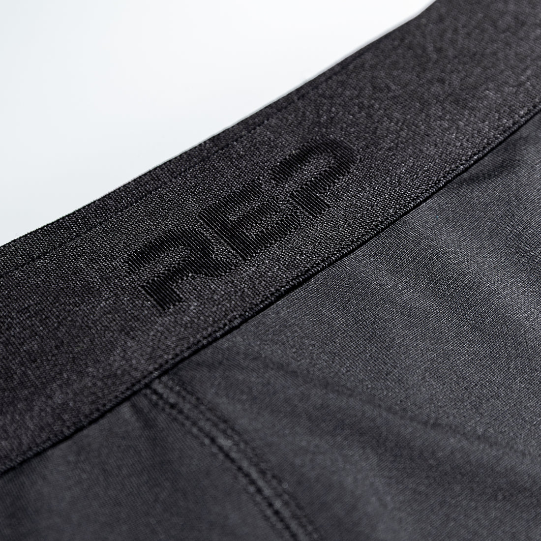 The REP Fitness Men's Foris Boxer Brief in Heather Black front, waistband detail