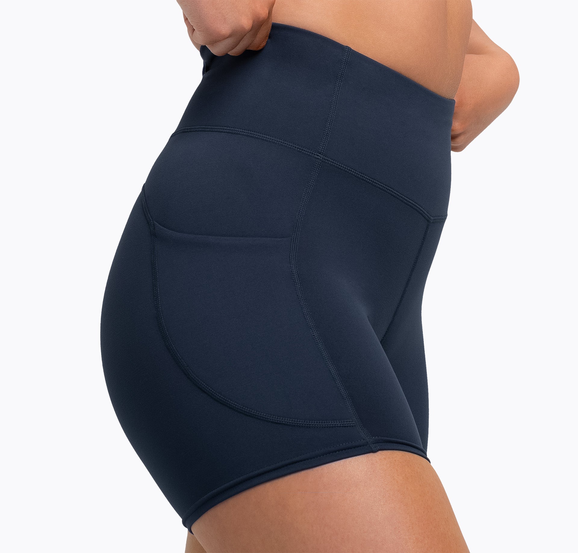 Athlete wearing the navy REP Women’s Forma Shorts in Navy.
