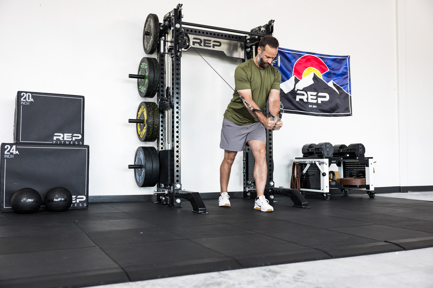 power rack with front foot extension pair 2.0 adding stability to front of rack while someone use cable machine attachment for flys