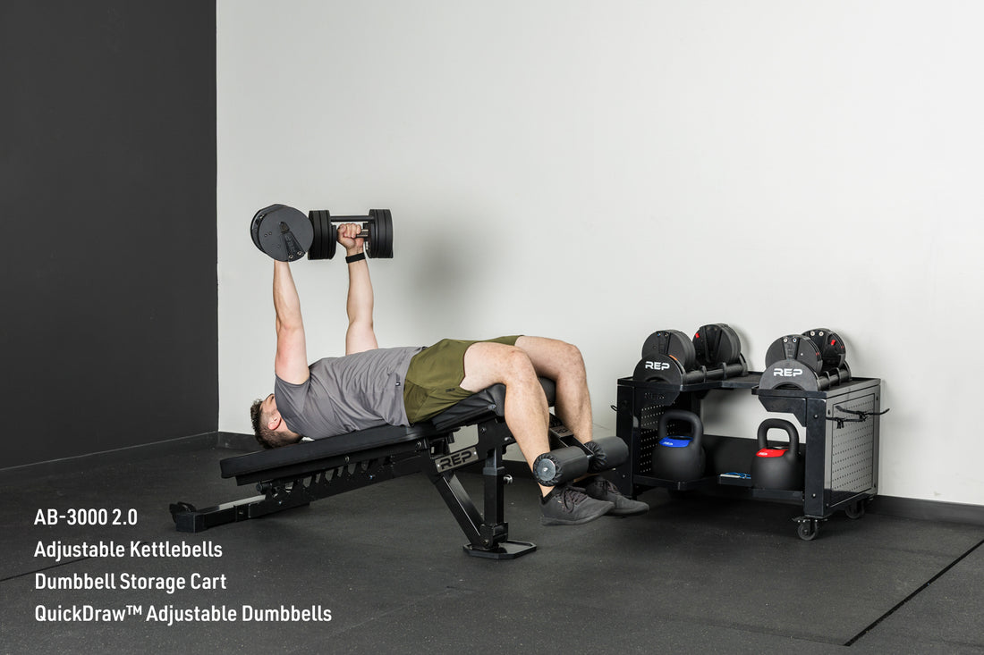 An athlete decline benching with the Quickdraw adjustable dumbbells on the AB-3000 2.0 adjustable bench
