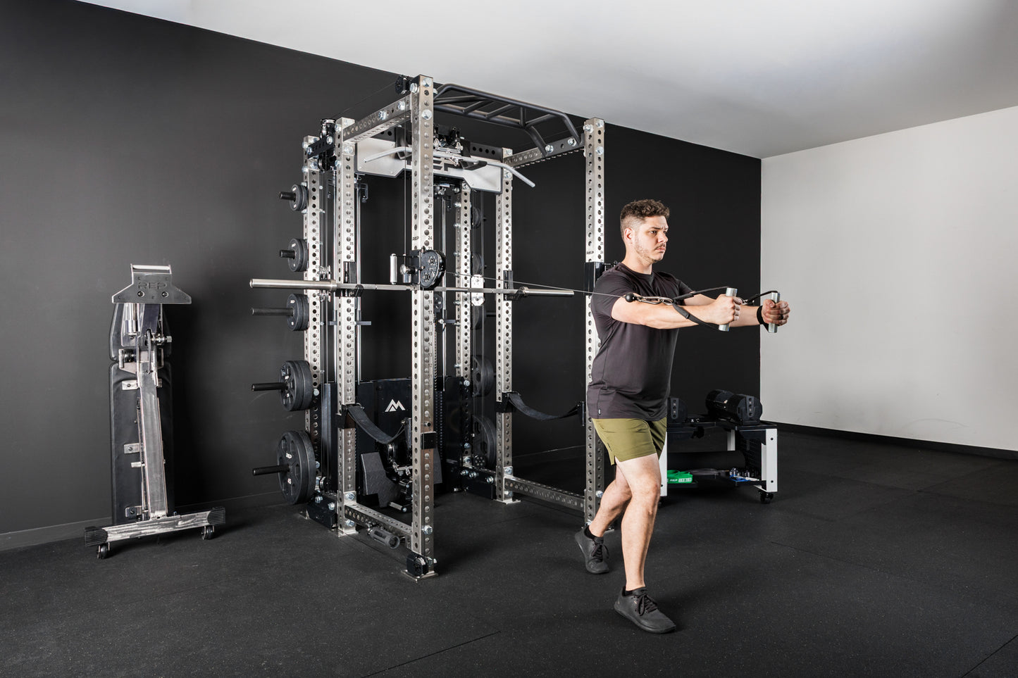 An athlete doing a cable fly exercise on the PR-5000 with an Ares 2.0