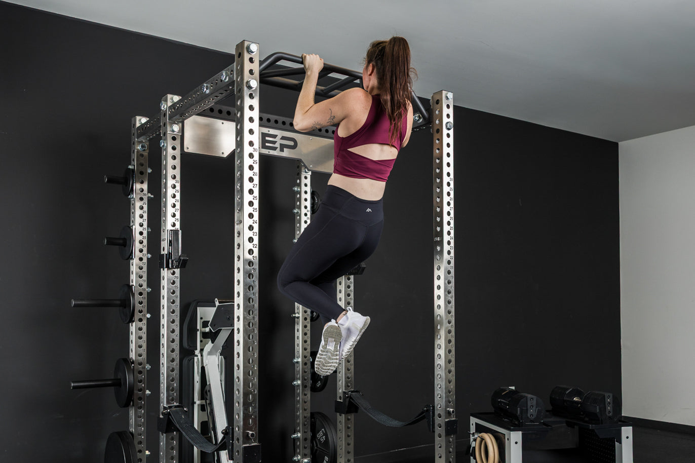 An athlete doing pull-ups on the multi-grip pull-up bar on the PR-5000 power rack