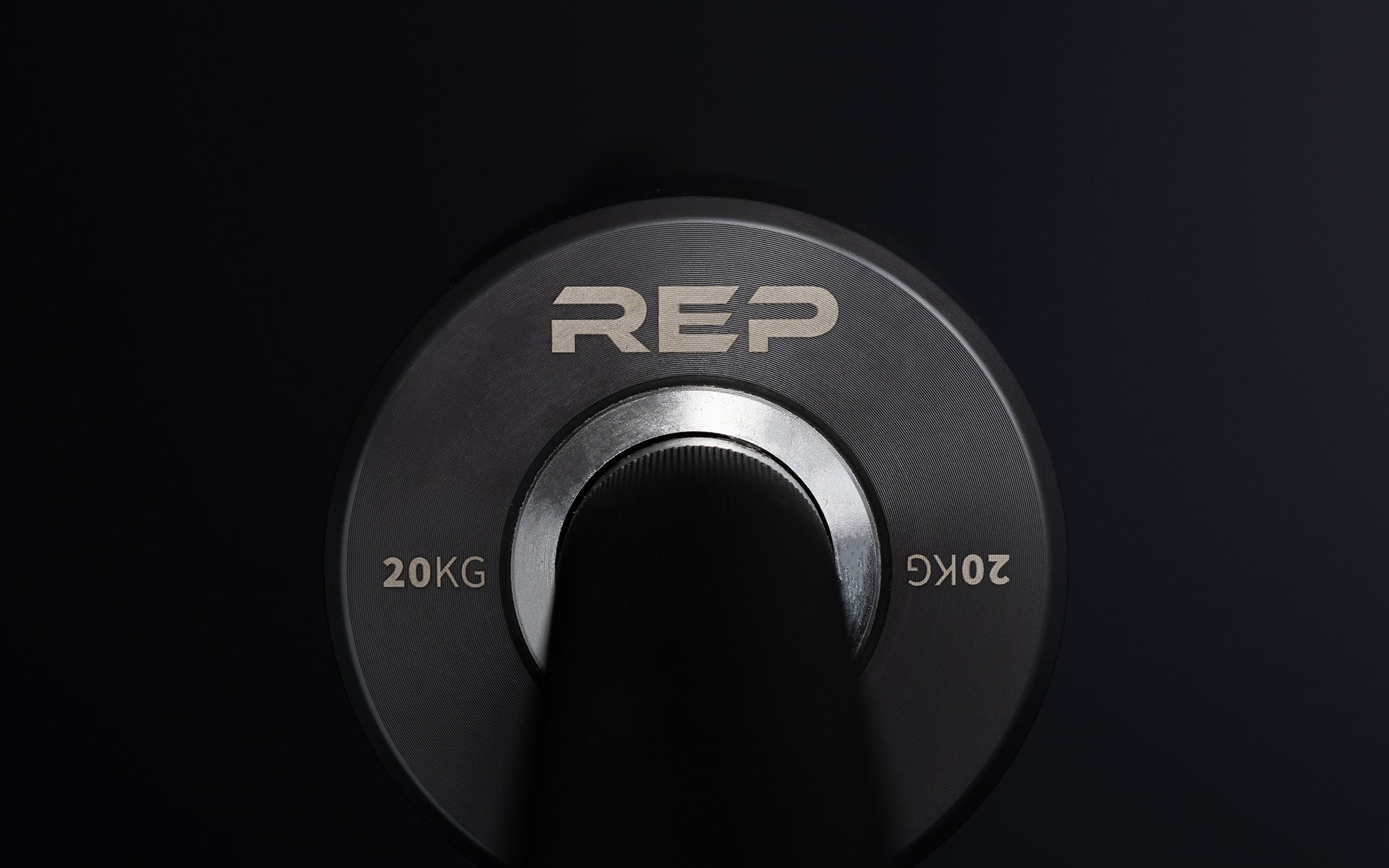 Close-up view of the laser-etched labeling on the inside of the sleeve of a REP Hades Deadlift Bar.