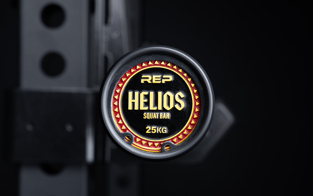 Close-up view of the uniquely designed metal endcap of a racked REP Helios Squat Bar.