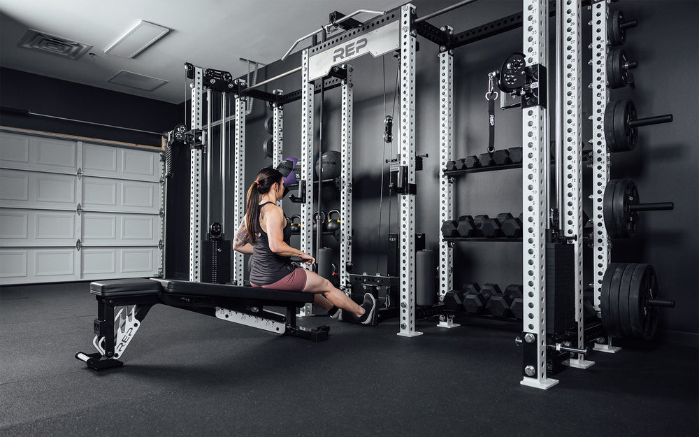 Athlete doing low row on a bench in the center of the Hyperion series 1.