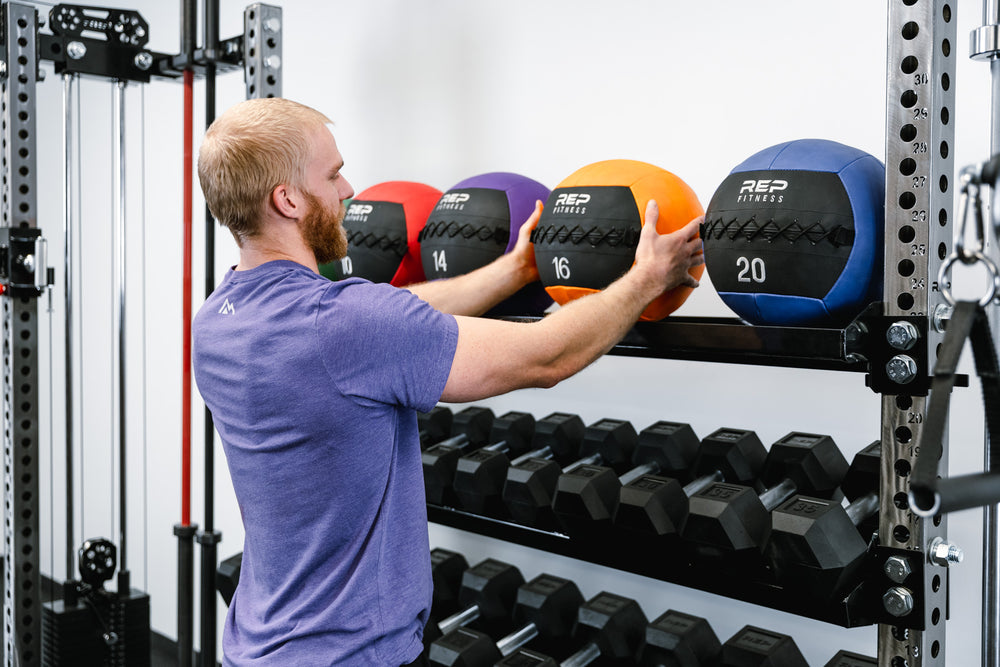 Dumbbell & Kettlebell Storage Shelf- Showing Kettlebell Storage Shelf Side holding medicine balls