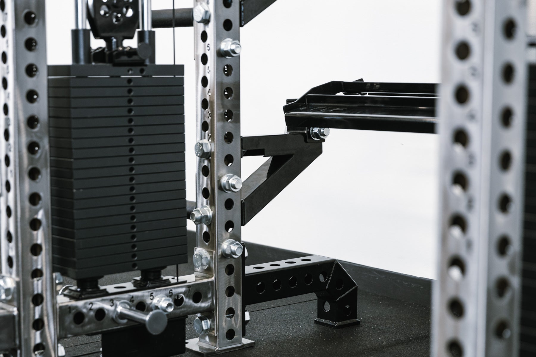 Elbow Brackets shown connected to Storage Shelf off the back of a rack with an Athena™ attachment