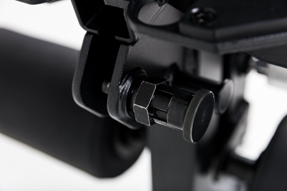 Close up of the lock-pin mechanism on the Leg Extension & Leg Curl Bench Attachment