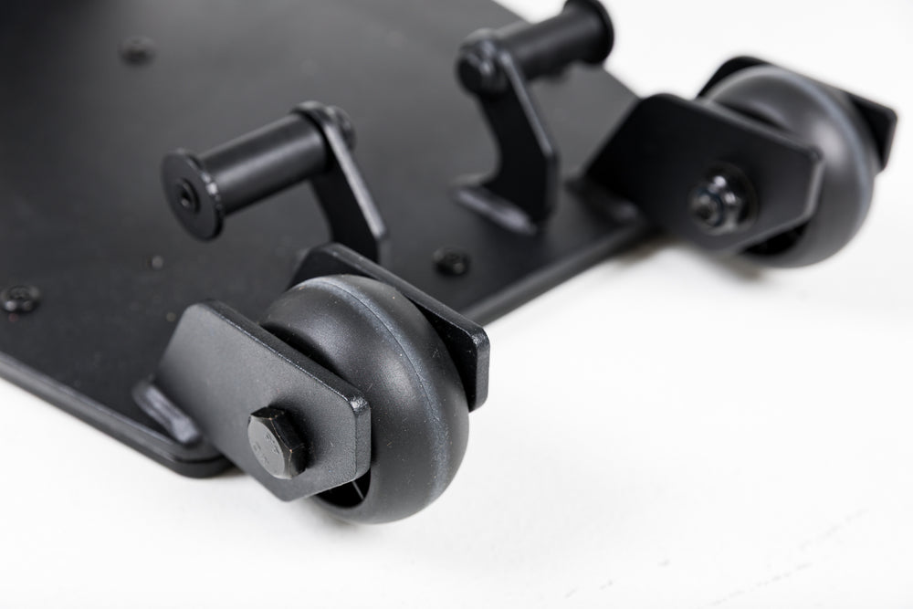 Close-up shot of the wheels on the Leg Extension & Leg Curl Bench Attachment