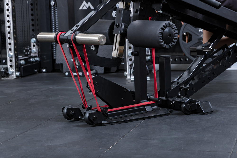 Close-up shot of a resistance band loaded onto the Leg Extension & Leg Curl Bench Attachment