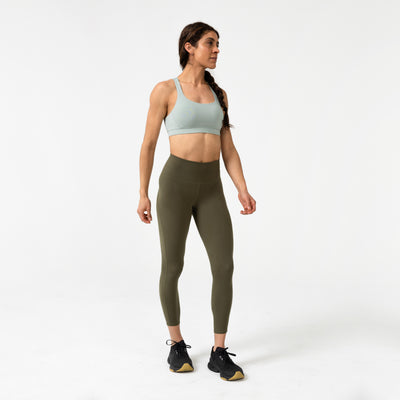 Athlete posing sideways in Aqua Gray Lattis Bra