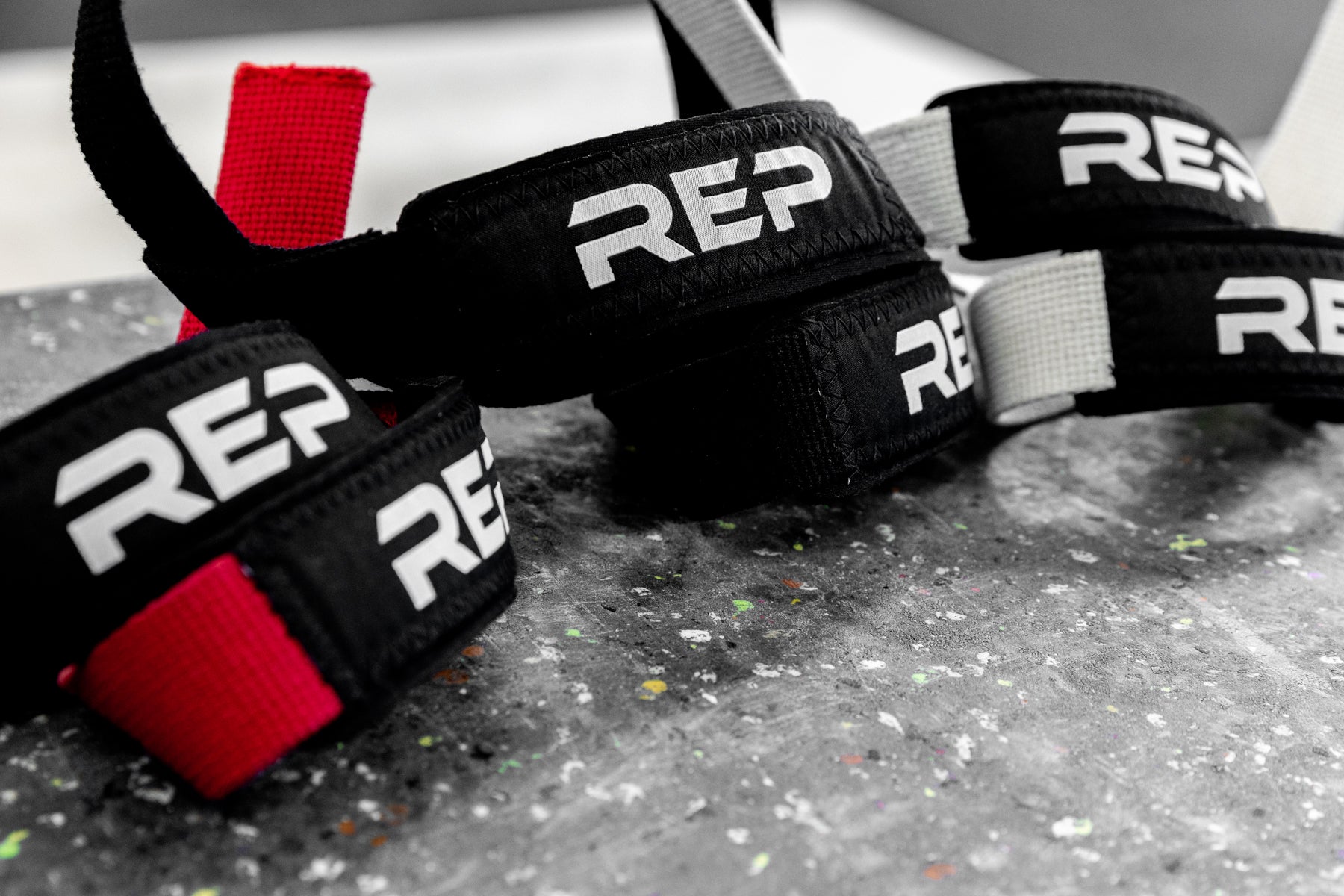 Red, Black, and White REP Lifting Straps.
