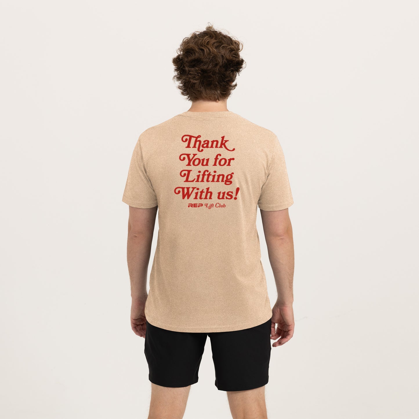 Athlete wearing the REP fitness Lift Club Tri-Blend Crew T-Shirt in Heather Desert/Red