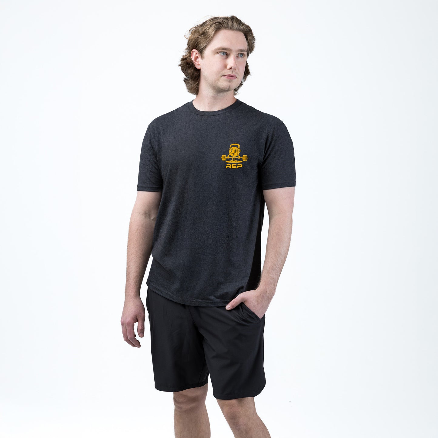 Athlete wearing the REP fitness Deadlift Party Tri-Blend Crew T-Shirt in Heather Black/Gold