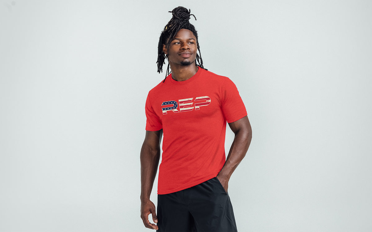 The REP Fitness Men's Daily Driver 2.0 USA Tri-Blend Crew T-Shirt in Heather Red/White front, on model