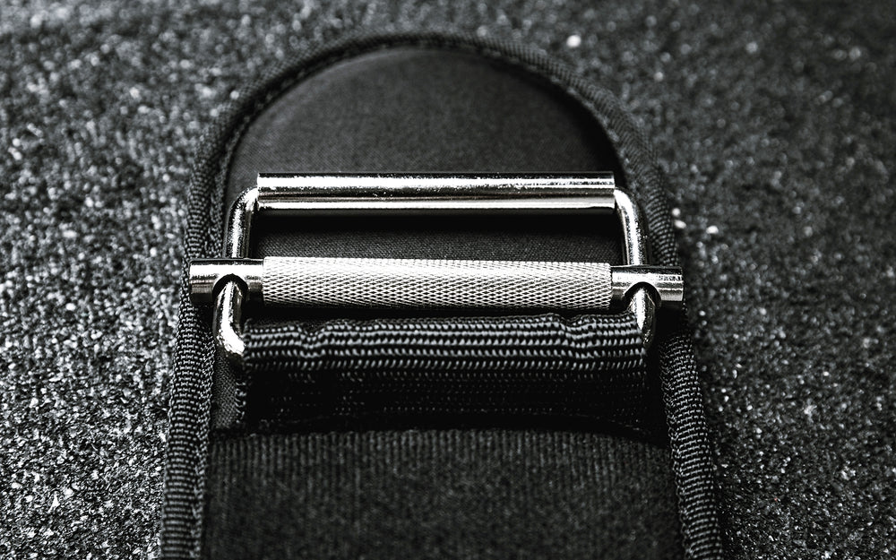 Close-up view of the steel buckle, roller, and knurled locking mechanism on the REP Nylon Lifting Belt.