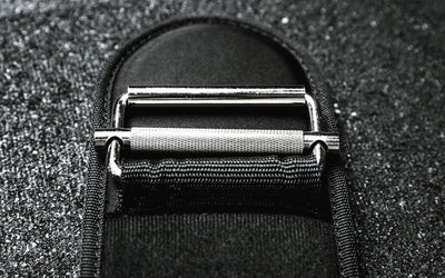 Close-up view of the steel buckle, roller, and knurled locking mechanism on the REP Nylon Lifting Belt.