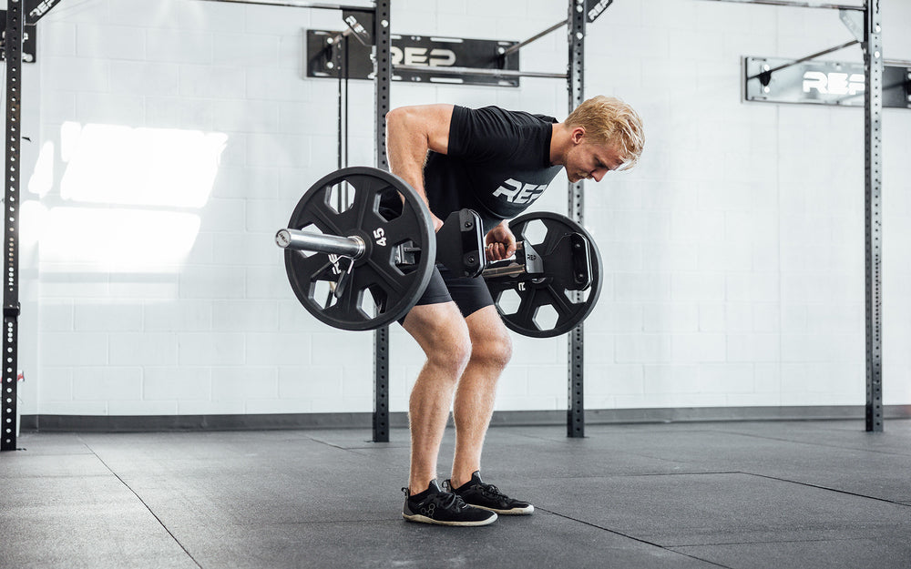 Male athlete performing a bent over row with the REP Open Trap Bar.