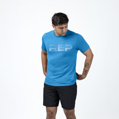 Athlete wearing REP fitness blueprint Tri-Blend Crew t-shirt in Heather Royal/White