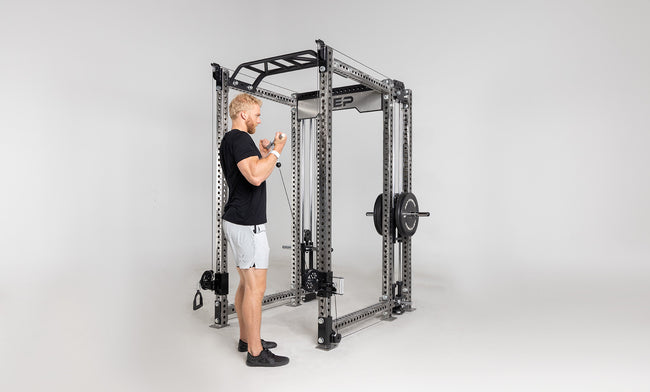Athena Plate-Loaded Side-Mount Functional Trainer Dual Side Shown on Clear Coat PR-5000 Power Rack Being Used For Bicep Curls