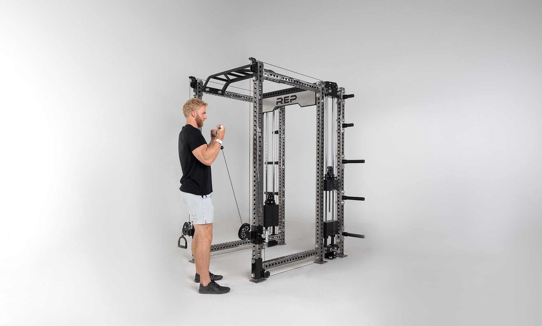 Athena Selectorized Side-Mount Functional Trainer Dual Side Shown on Clear Coat PR-5000 Power Rack Being Used For Bicep Curls