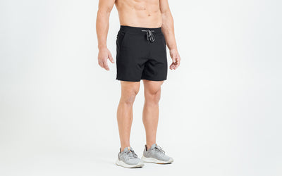 Front view of model wearing the Black REP Pinnacle Shorts.