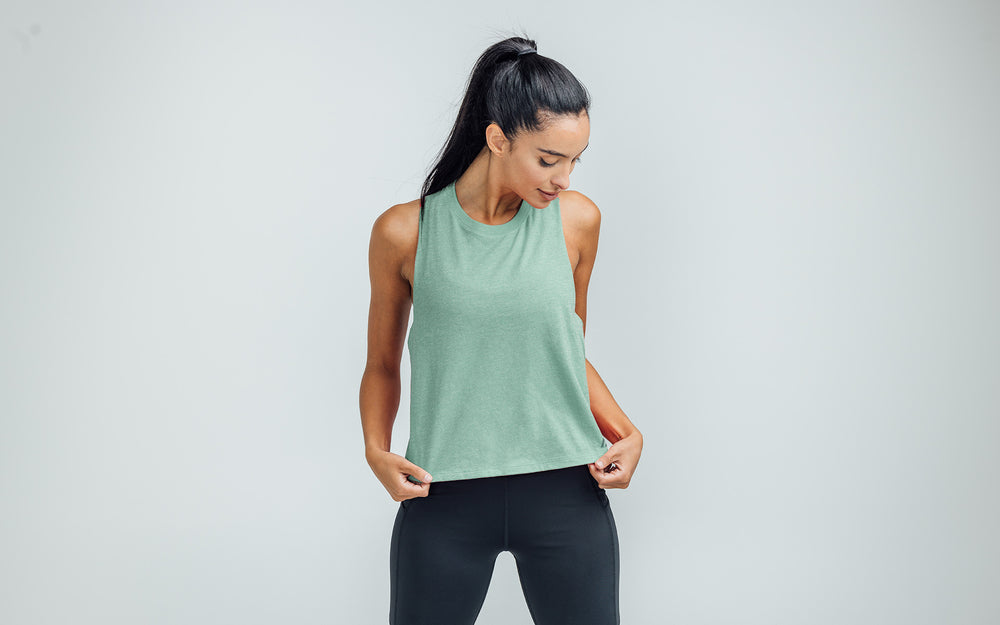 Woman wearing Heather Sage/Sage Peak Cropped Dual-Blend Tank