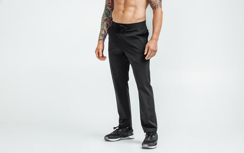 Front view of model wearing the black REP Felix Pants.