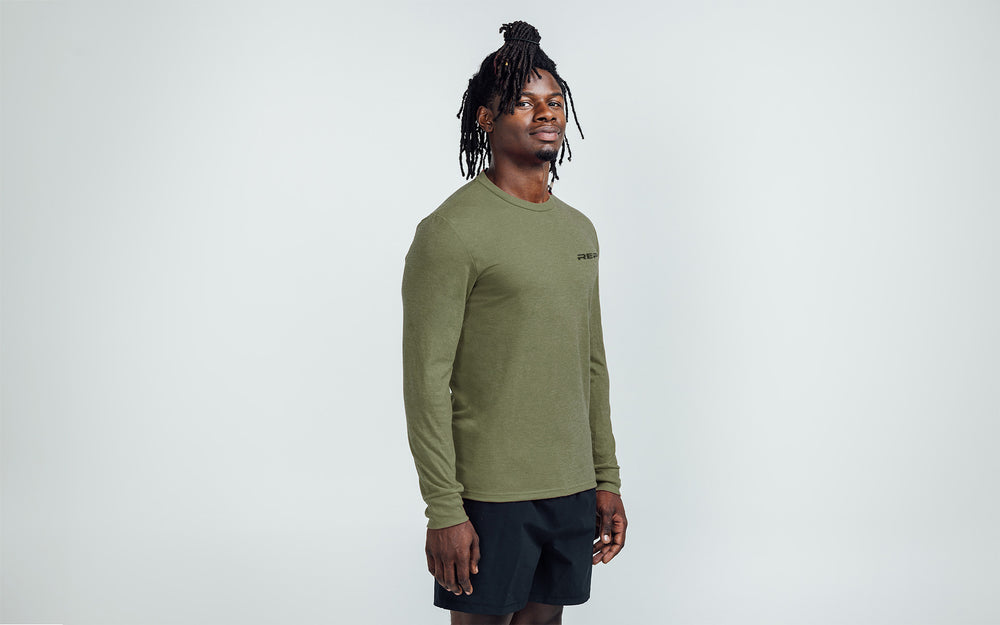 Man wearing Heather Olive/Black Long-Sleeved Tri-Blend Crew