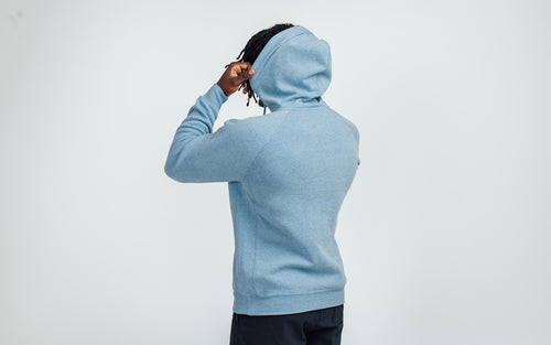 Man wearing Heather Light Blue/Silver Unisex Zip Hoodie - Back view, hood up