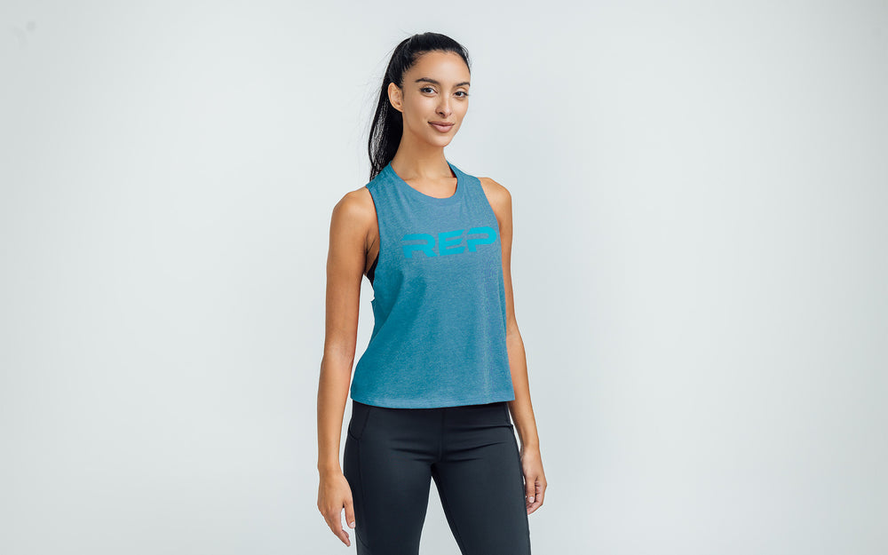 Woman wearing Heather Teal/Teal Daily Driver Cropped Dual-Blend Tank