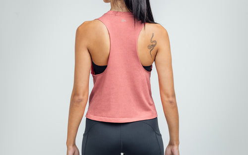Woman wearing Heather Mauve/Cool Gray Daily Driver Cropped Dual-Blend Tank - Back view