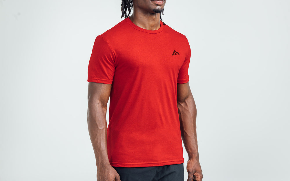 Man wearing Heather Red/Black Men's Peak Tri-Blend Crew