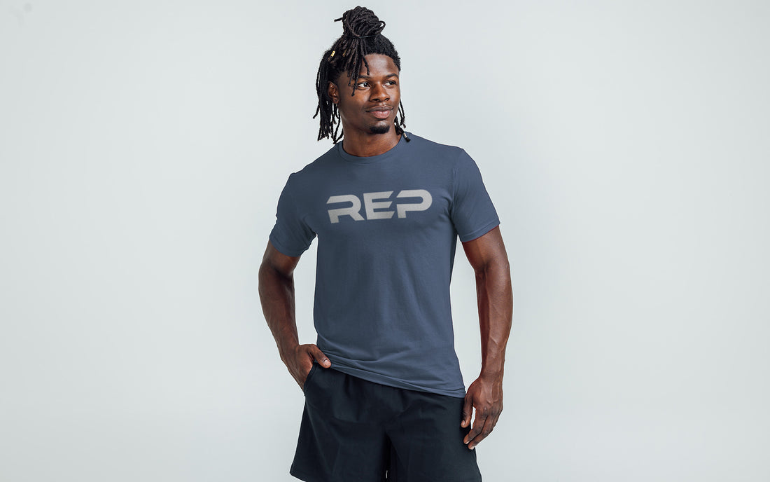 The REP Fitness Men's Daily Driver 2.0 Tri-Blend Crew T-Shirt in Heather Navy/Silver on body