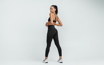 Back view of model wearing the REP Hera Tights in Black.