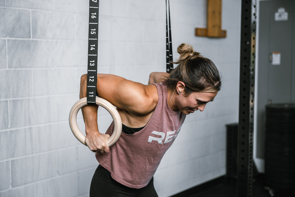 Athlete performing dips on the REP Competition Gymnastic Straps to the Wood Rings