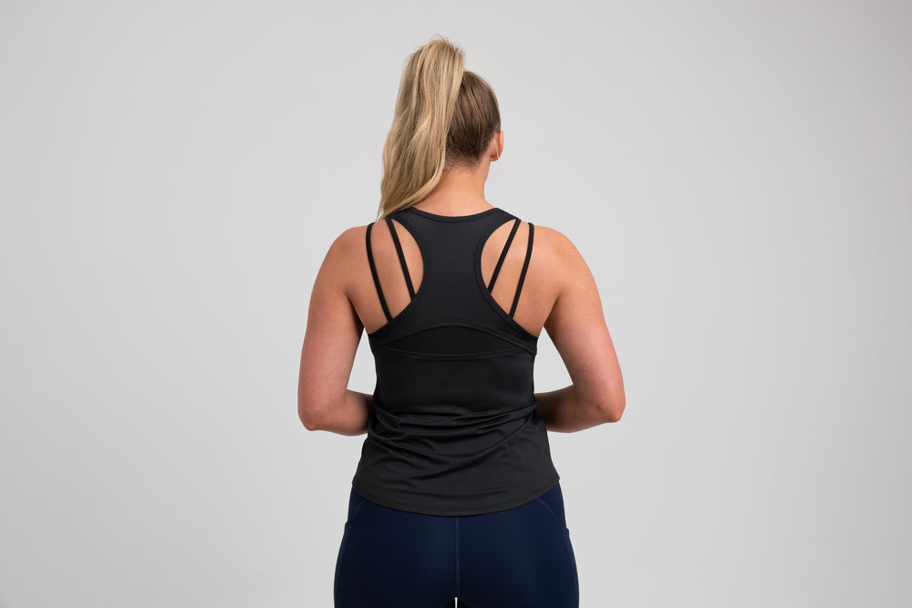 Athlete wearing a black REP Women’s Clio Tank Top.