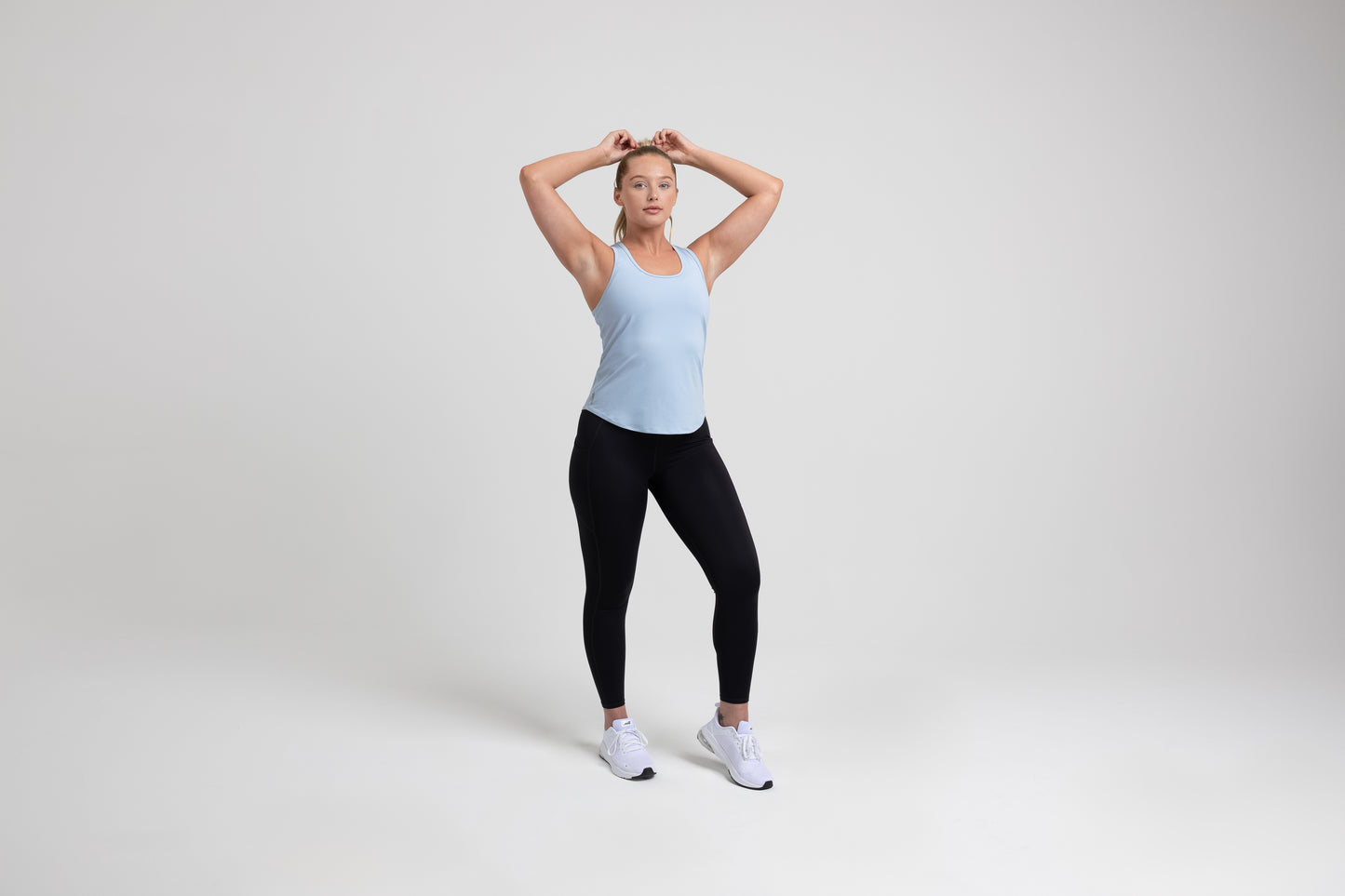 Athlete wearing a periwinkle REP Women’s Clio Tank Top.