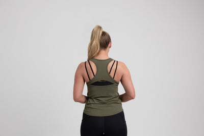 Athlete wearing an olive REP Women’s Clio Tank Top.
