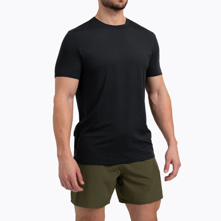 Athlete wearing a black REP Men's Delta Tee.