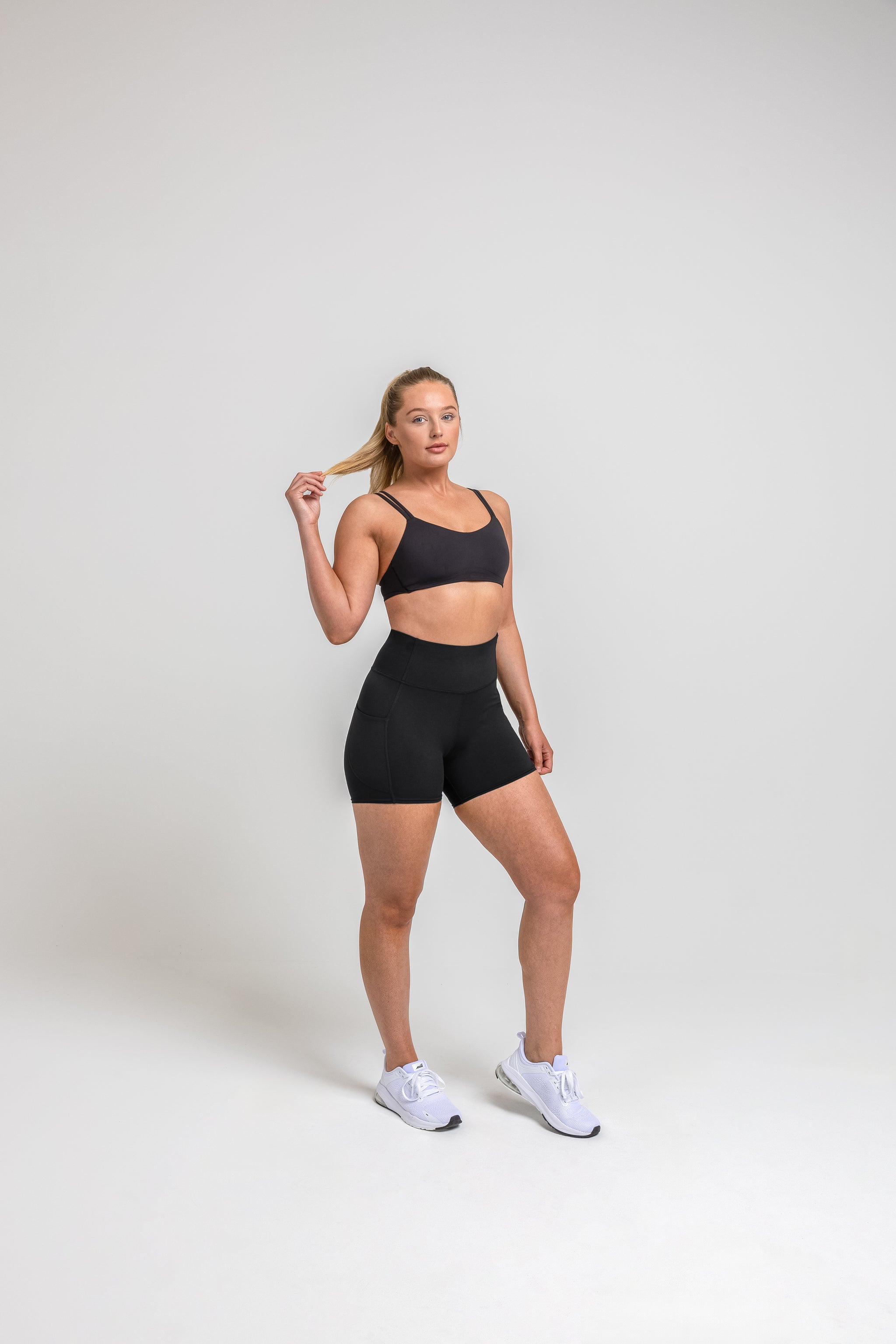 Athlete wearing the Black REP Women’s Forma Shorts.