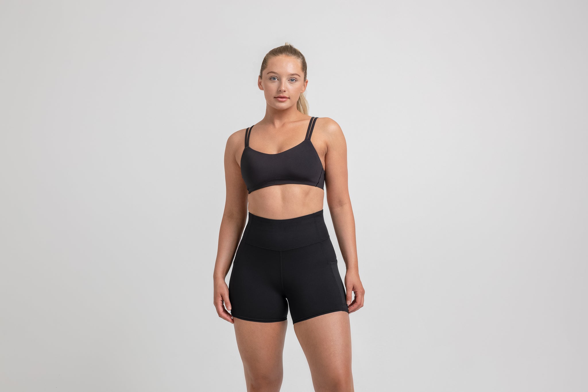 Athlete wearing the Black REP Women’s Forma Shorts.