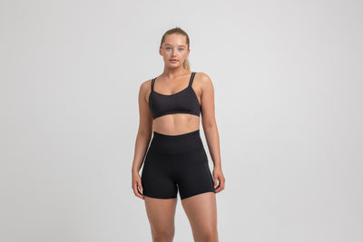 Athlete wearing the Black REP Women’s Forma Shorts.